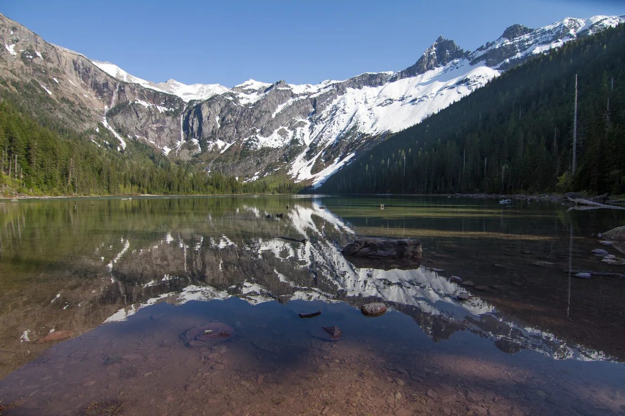 Avalanche Lake — a glacier-carved jewel reflecting snow-capped peaks